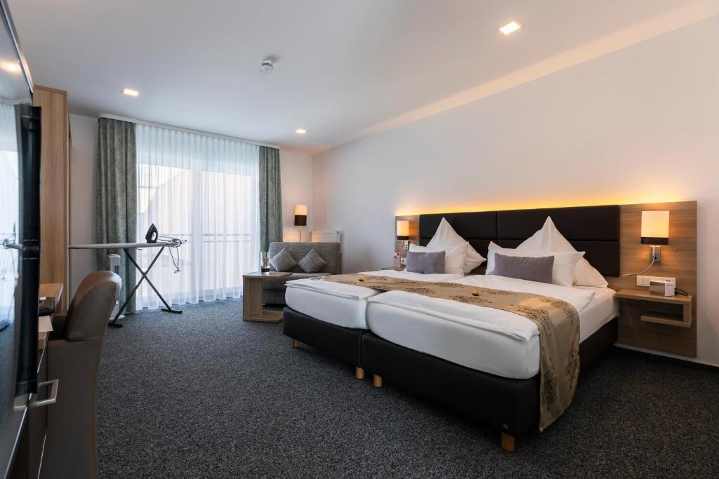 Postel nebo postele na pokoji v ubytování Stadthotel Geis