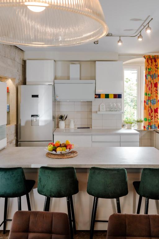 Kuchyň nebo kuchyňský kout v ubytování Casa Carminatti Apartments