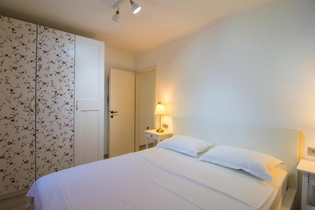 Postel nebo postele na pokoji v ubytování Apartments Pina