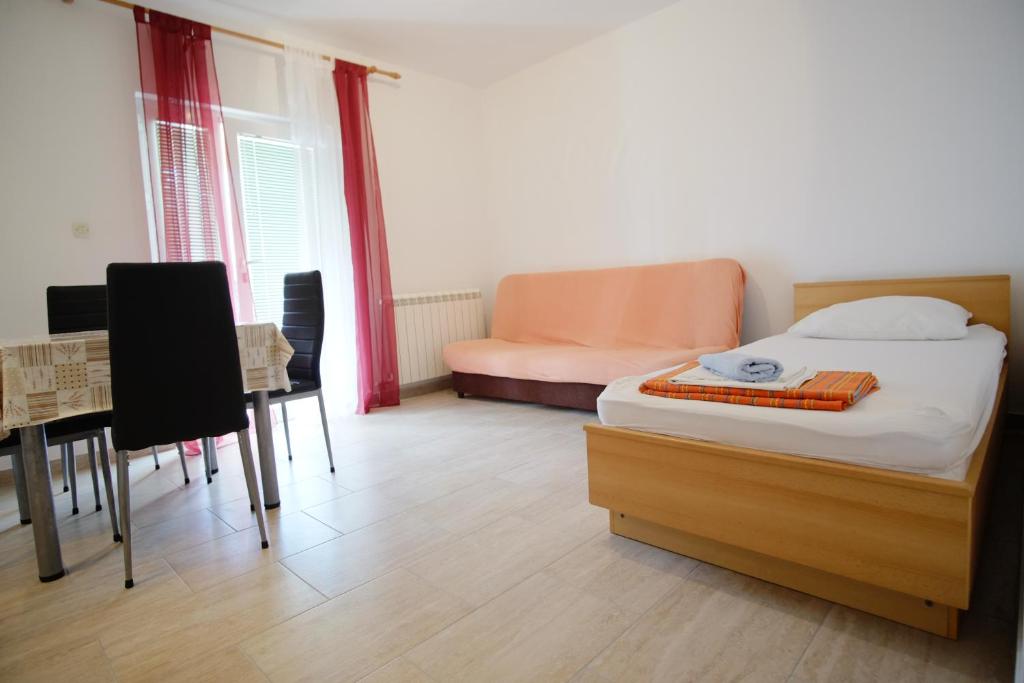Postel nebo postele na pokoji v ubytování Apartment Gordana