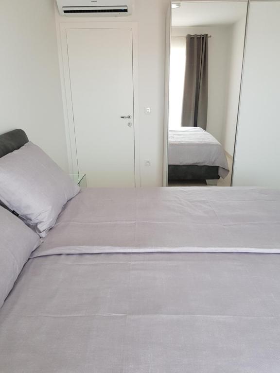 Postel nebo postele na pokoji v ubytování Apartmani MARELLA