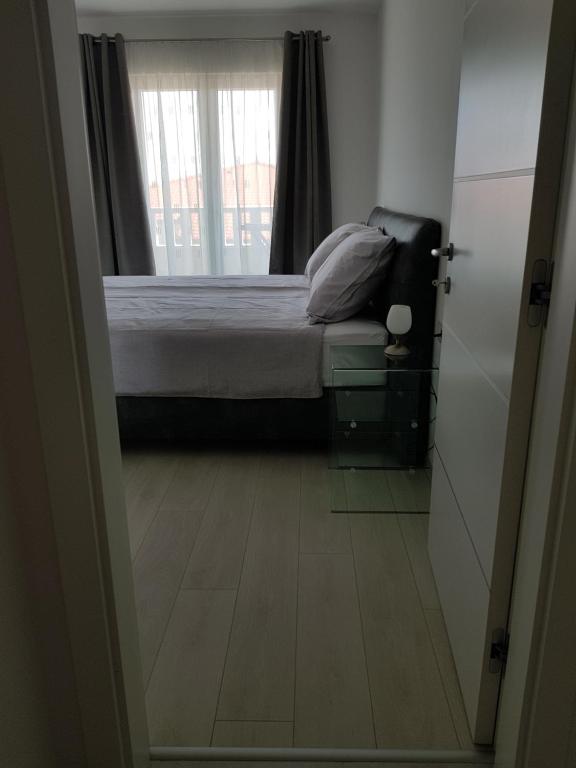Postel nebo postele na pokoji v ubytování Apartmani MARELLA