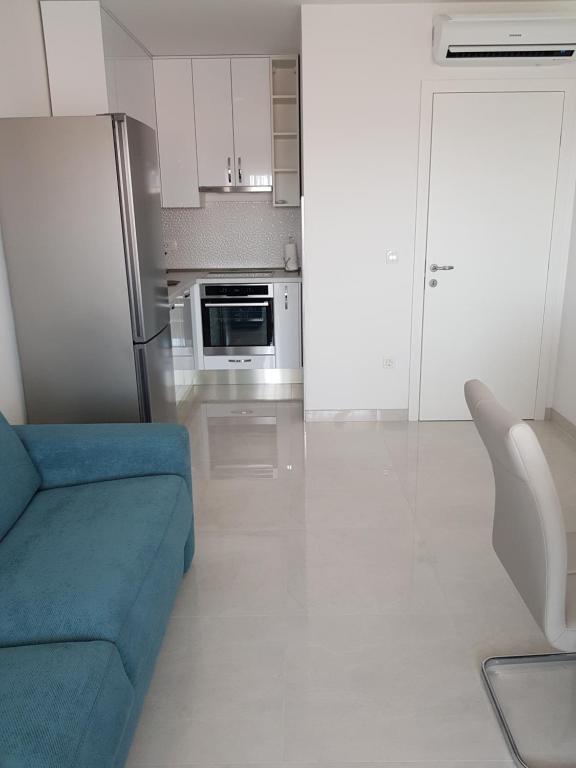 Kuchyň nebo kuchyňský kout v ubytování Apartmani MARELLA