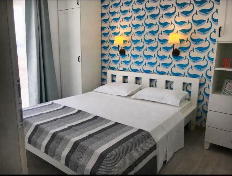 Postel nebo postele na pokoji v ubytování Apartments Pina