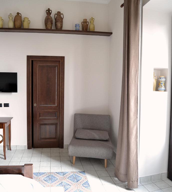 TV a/nebo společenská místnost v ubytování BnB Agorà Panoramic Rooms