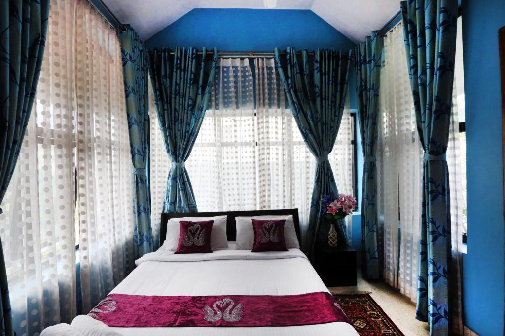 Postel nebo postele na pokoji v ubytování LikeMyHome Homestay Mysore