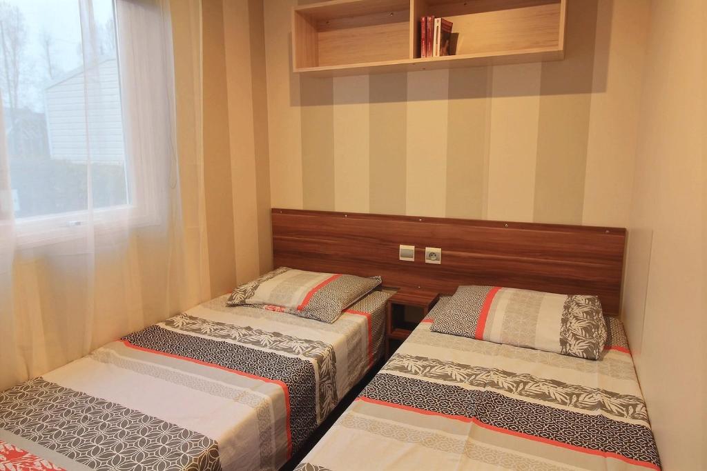 Postel nebo postele na pokoji v ubytování MOBILHOME Familial