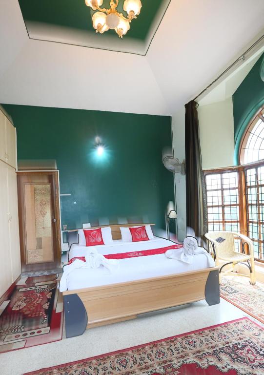 Postel nebo postele na pokoji v ubytování LikeMyHome Homestay Mysore