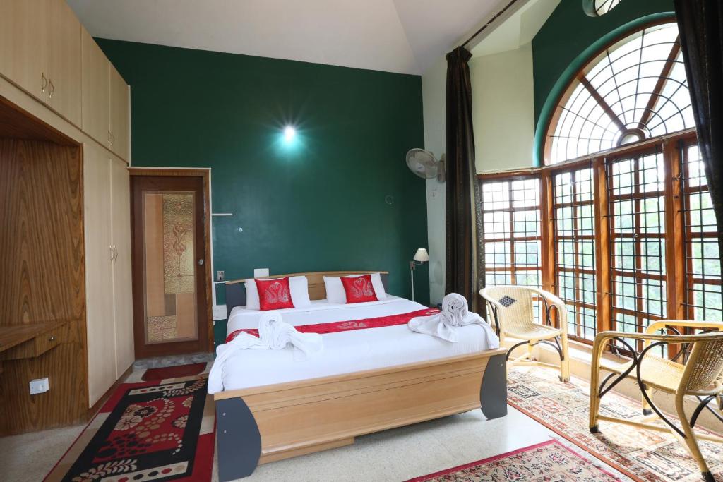 Postel nebo postele na pokoji v ubytování LikeMyHome Homestay Mysore