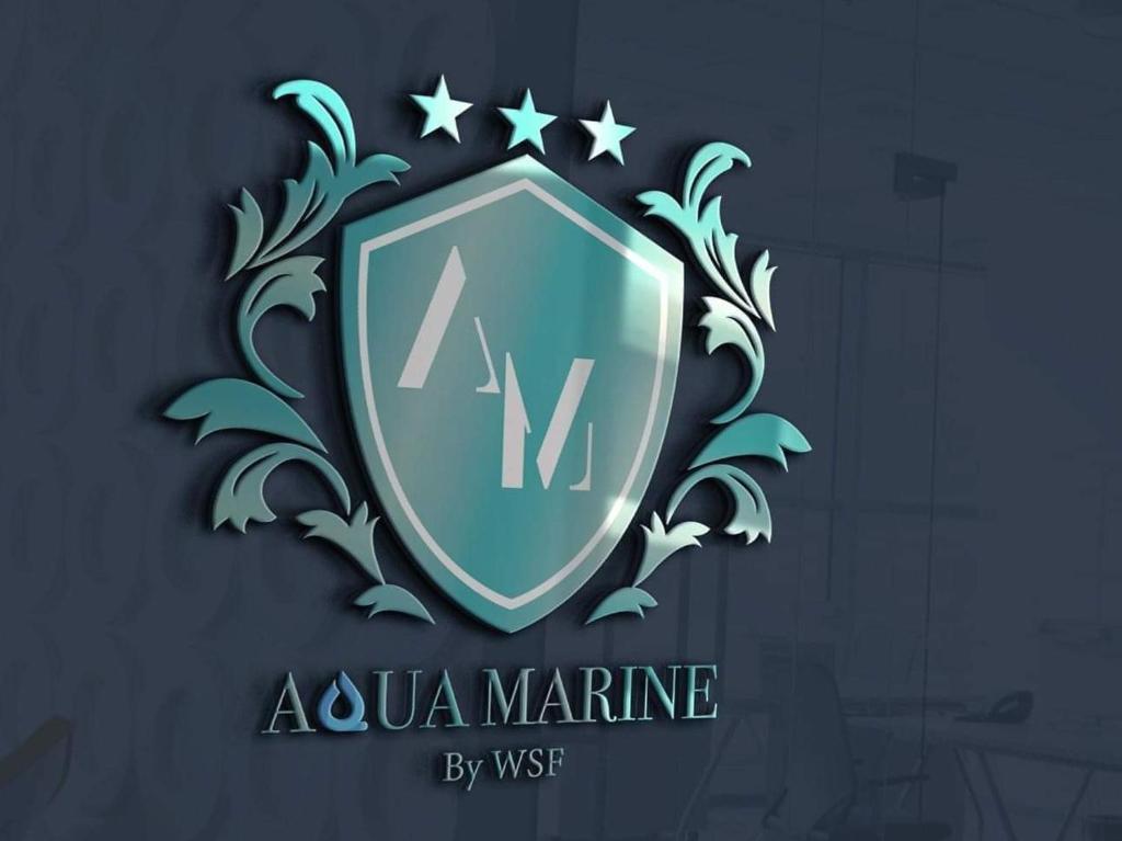 a shield with the words akuna marine on it at Hotel AquaMarine in Costinesti