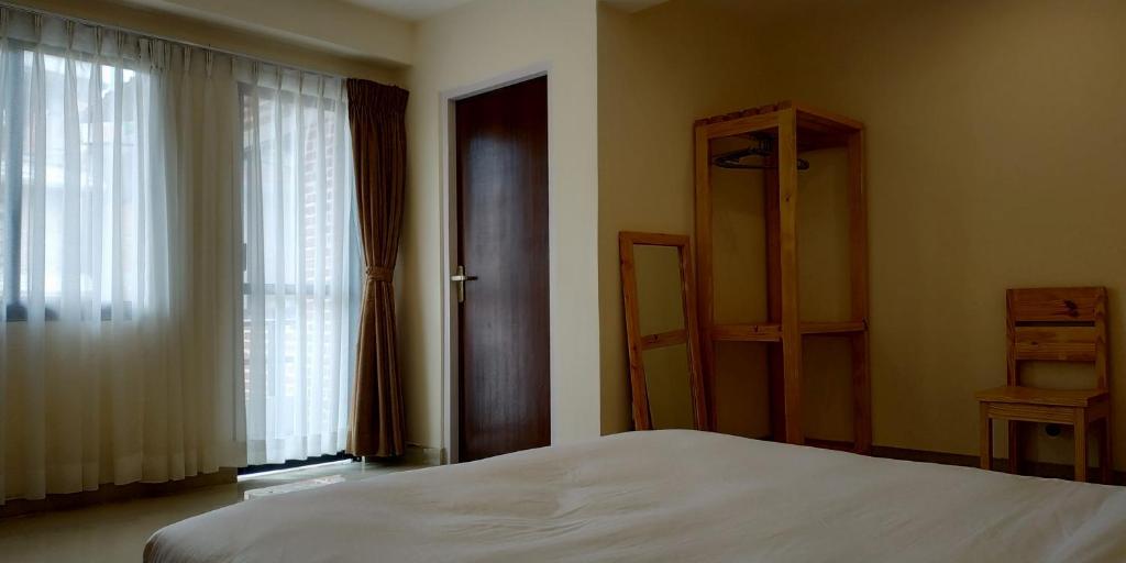 Postel nebo postele na pokoji v ubytování Sayami Home