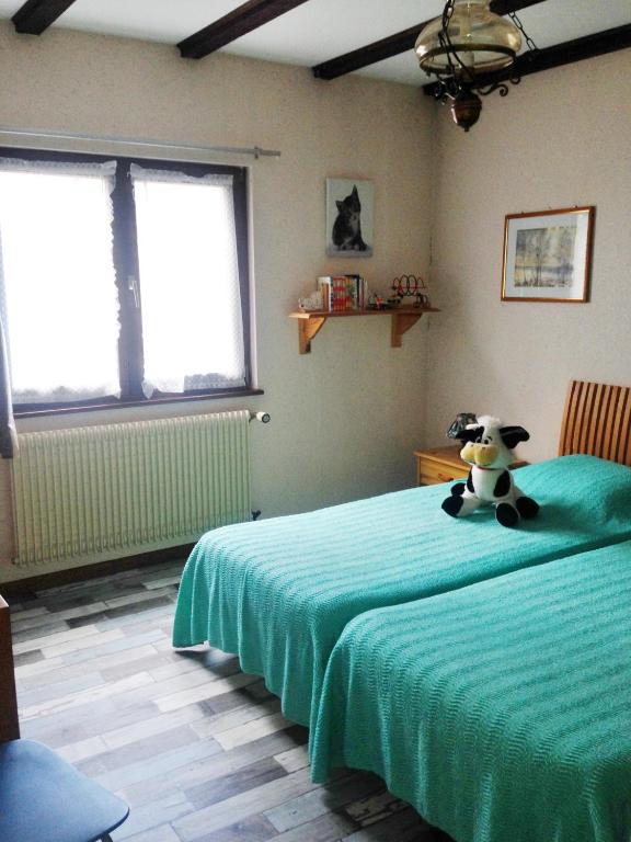 Postel nebo postele na pokoji v ubytování Chambres d'hôtes et Gîte chez Martine