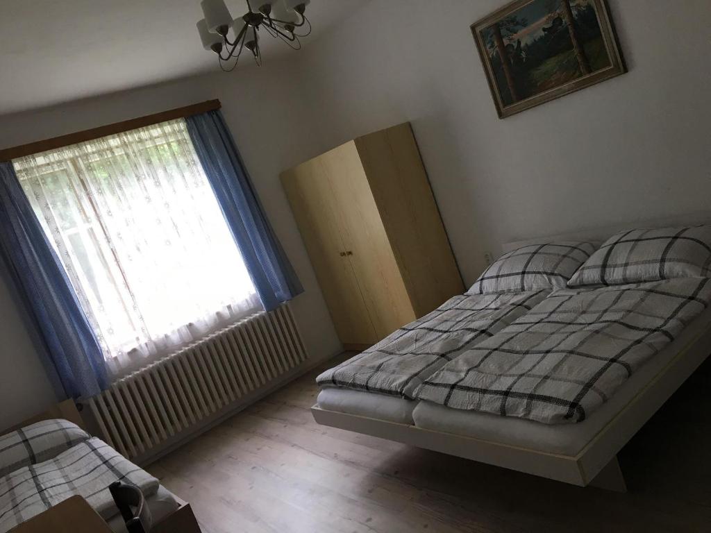 Postel nebo postele na pokoji v ubytování Chaloupka