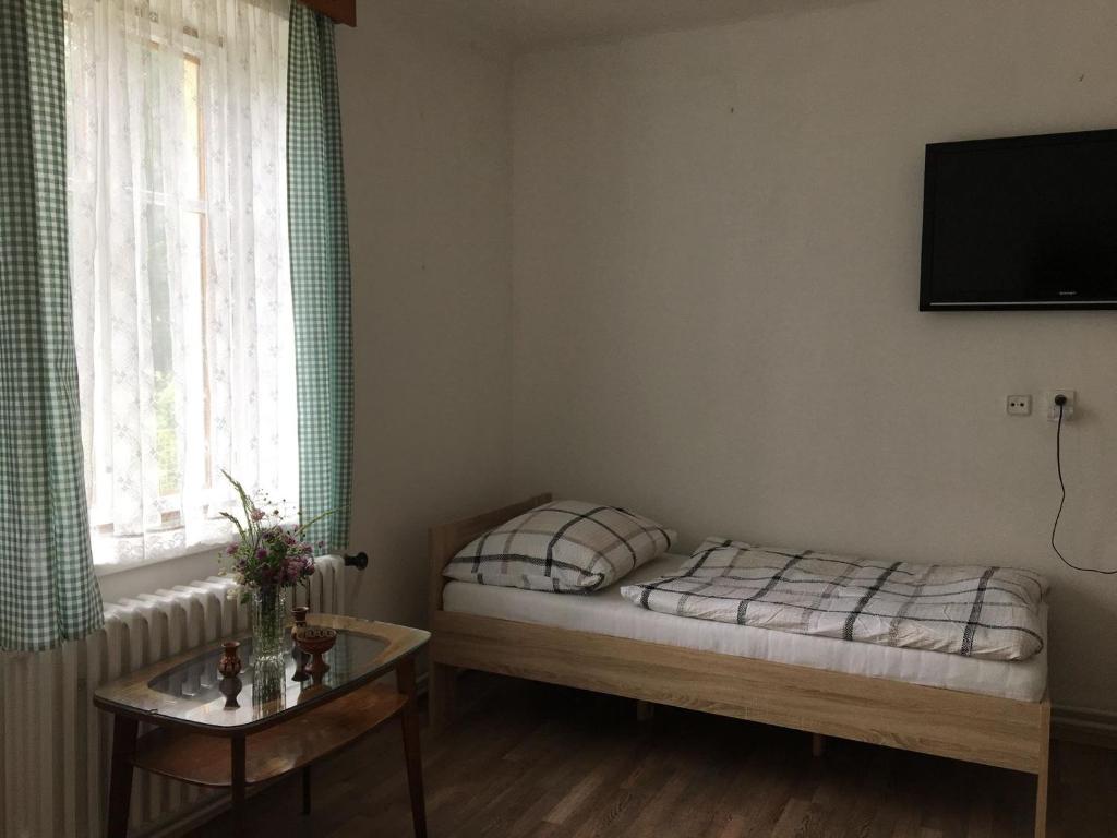 Postel nebo postele na pokoji v ubytování Chaloupka