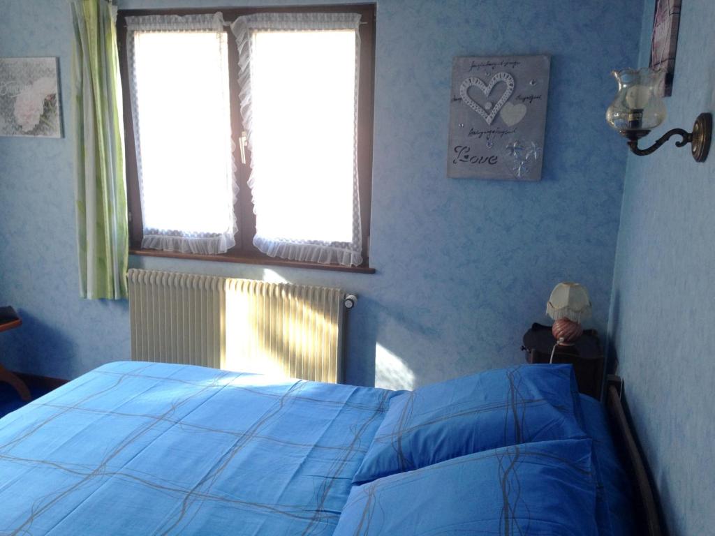 Postel nebo postele na pokoji v ubytování Chambres d'hôtes et Gîte chez Martine