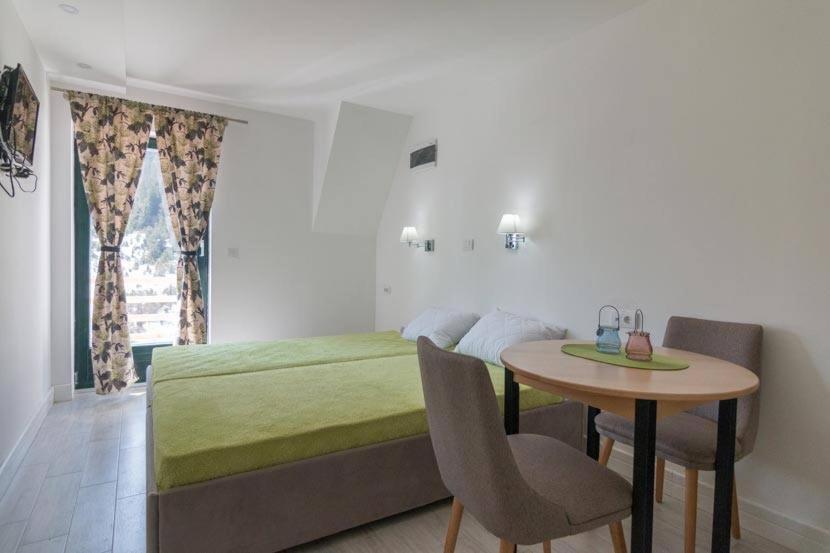 Postel nebo postele na pokoji v ubytování Apartmani Terase