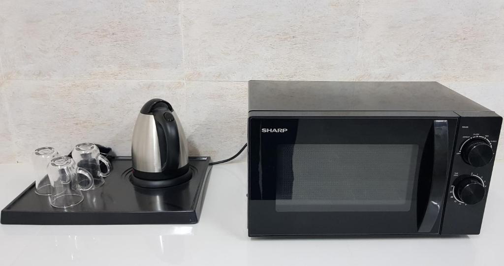 Kuchyň nebo kuchyňský kout v ubytování Duqm Suites