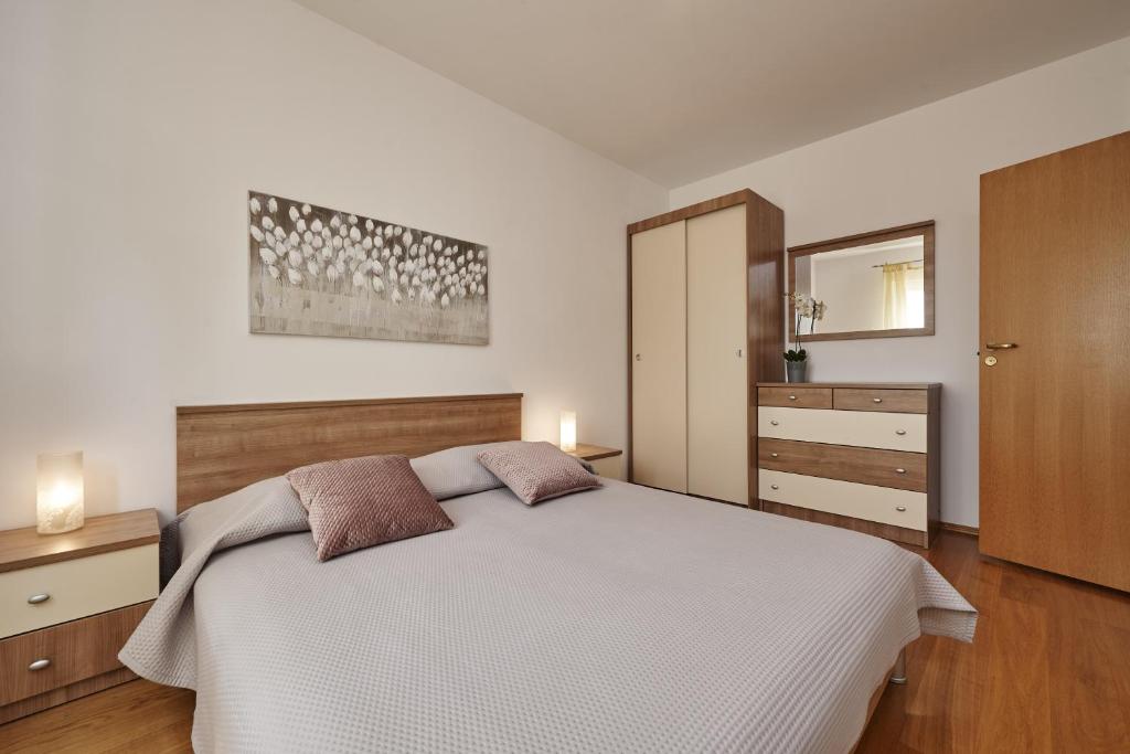 Posteľ alebo postele v izbe v ubytovaní Buonocore apartment