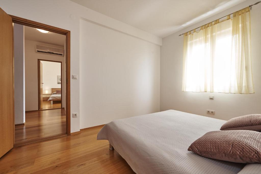 Posteľ alebo postele v izbe v ubytovaní Buonocore apartment