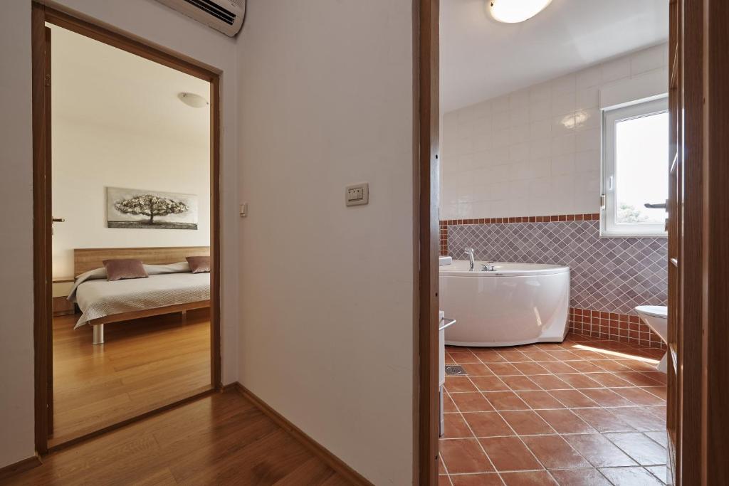 Posteľ alebo postele v izbe v ubytovaní Buonocore apartment