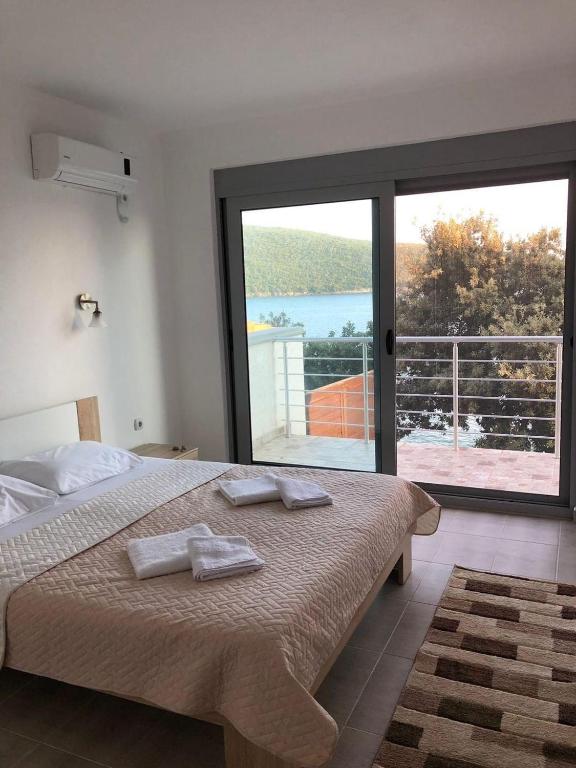 Postel nebo postele na pokoji v ubytování Apartman Ail 2