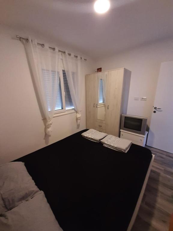 Postel nebo postele na pokoji v ubytování Apartments Marina
