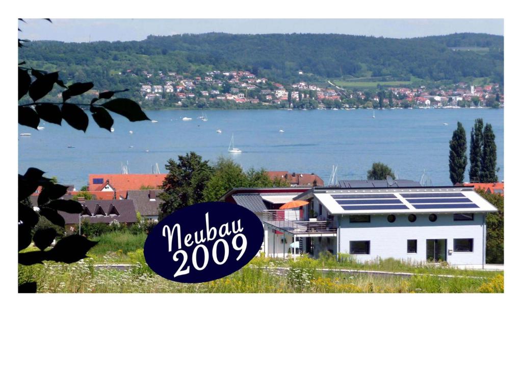 a house with solar panels on top of it at Haus Bodenseeblick in Bodman-Ludwigshafen