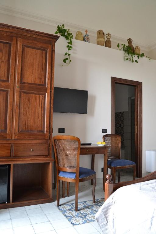 TV a/nebo společenská místnost v ubytování BnB Agorà Panoramic Rooms