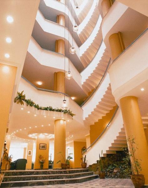 a large lobby with stairs and a spiral ceiling at Silivri Park Hotel in Silivri