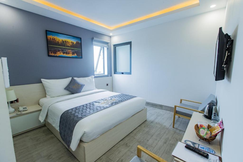 Postel nebo postele na pokoji v ubytování Dang's Hotel