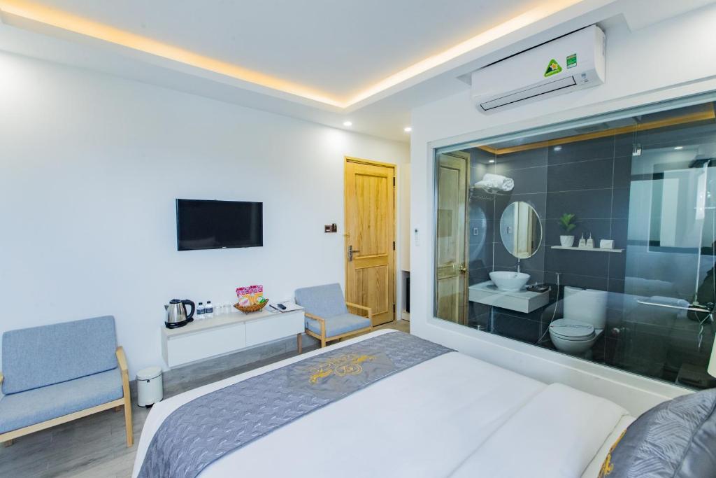 Postel nebo postele na pokoji v ubytování Dang's Hotel