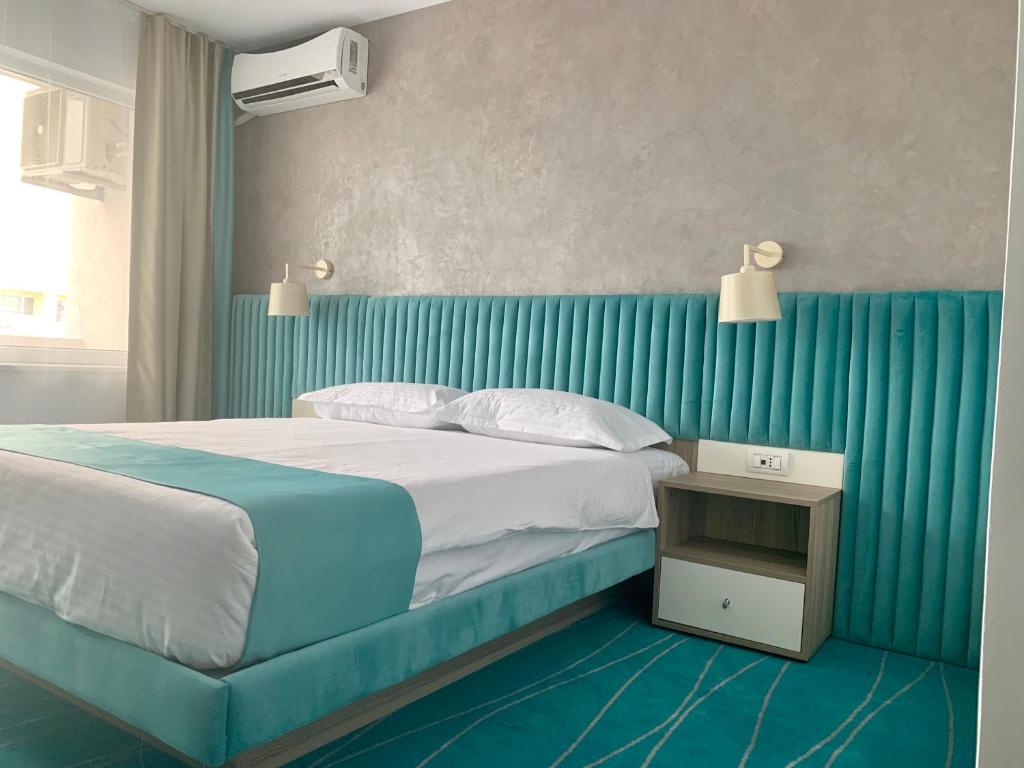 Postel nebo postele na pokoji v ubytování Hotel Meteor