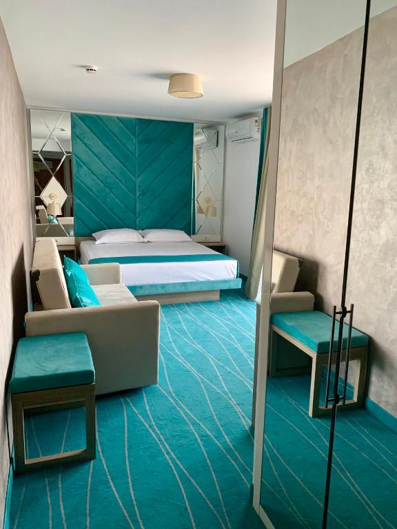 Postel nebo postele na pokoji v ubytování Hotel Meteor