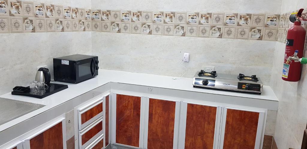 Kuchyň nebo kuchyňský kout v ubytování Duqm Suites