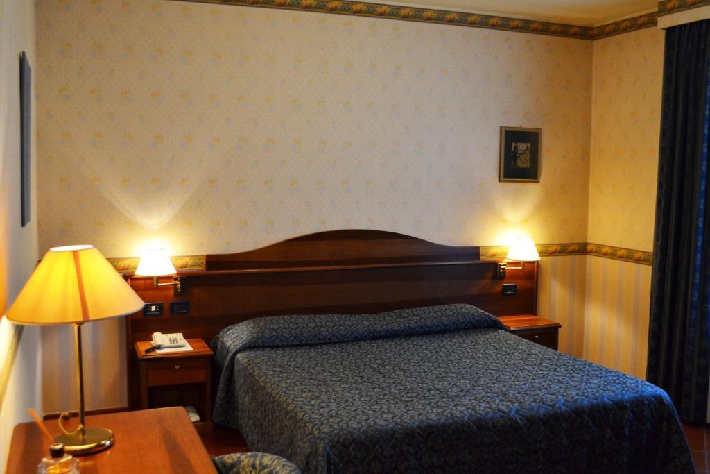 Postel nebo postele na pokoji v ubytování Ariotto Village