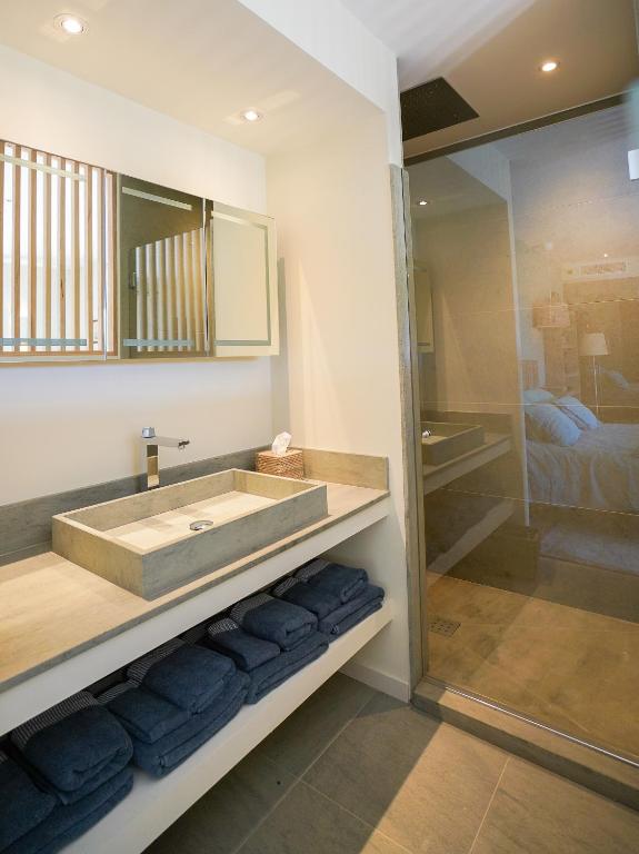 a bathroom with a sink and a shower at villa Sant-Anna in Saint-Tropez