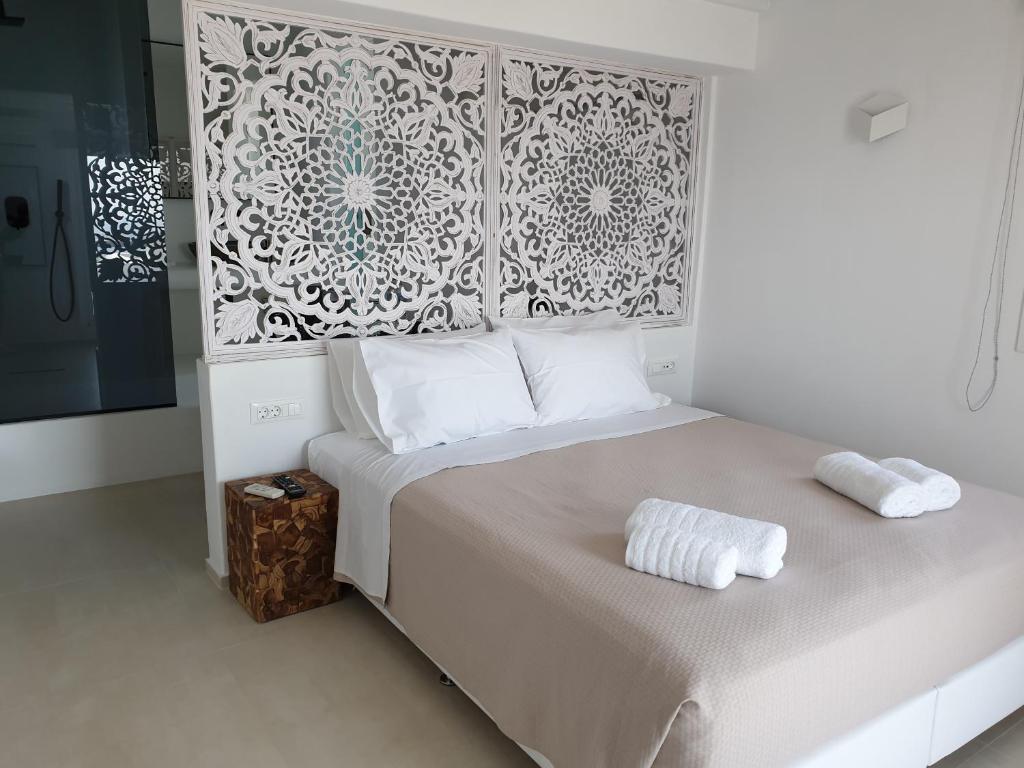 Postel nebo postele na pokoji v ubytování Bellou Suites