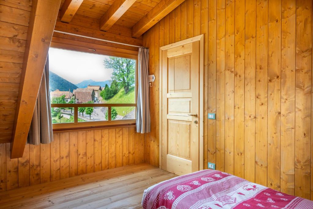 En eller flere senger på et rom på Albergo Diffuso Ravascletto