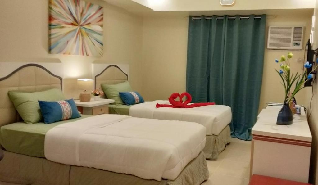מיטה או מיטות בחדר ב-IT PARK, Cebu City, Twin Beds Avida Riala - unlimited data fast internet up to 100mbps
