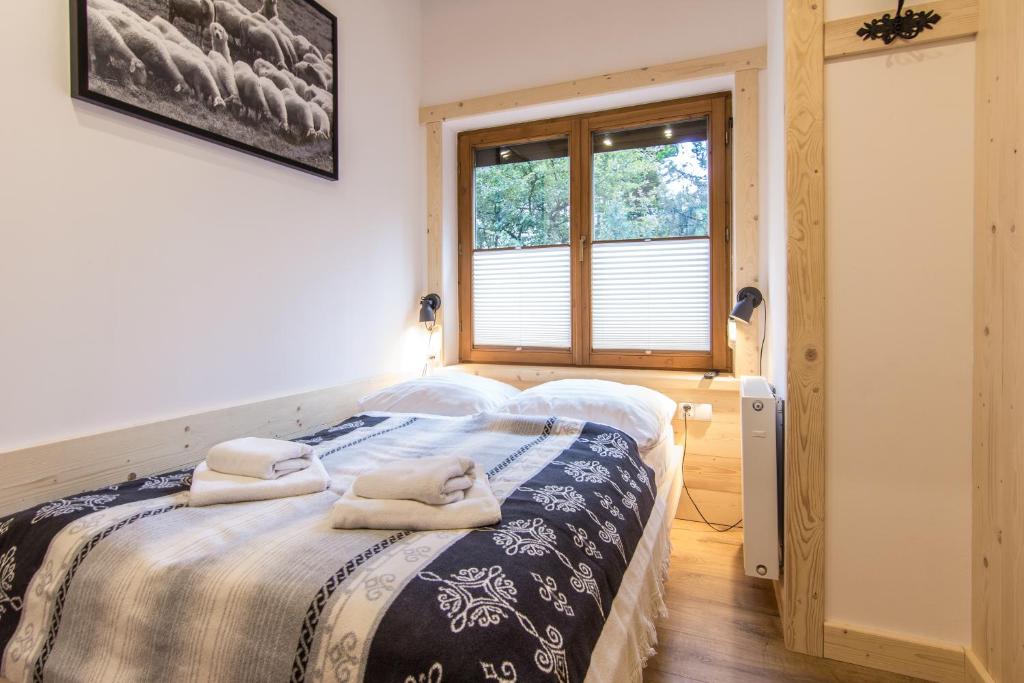 Posteľ alebo postele v izbe v ubytovaní Apartamenty Orkana Centrum Zakopane