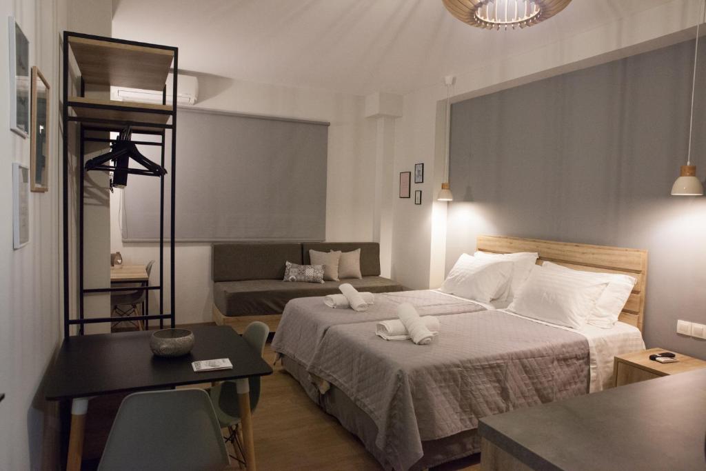 Кровать или кровати в номере 2the Point Athens Suites & Appartments in Plaka