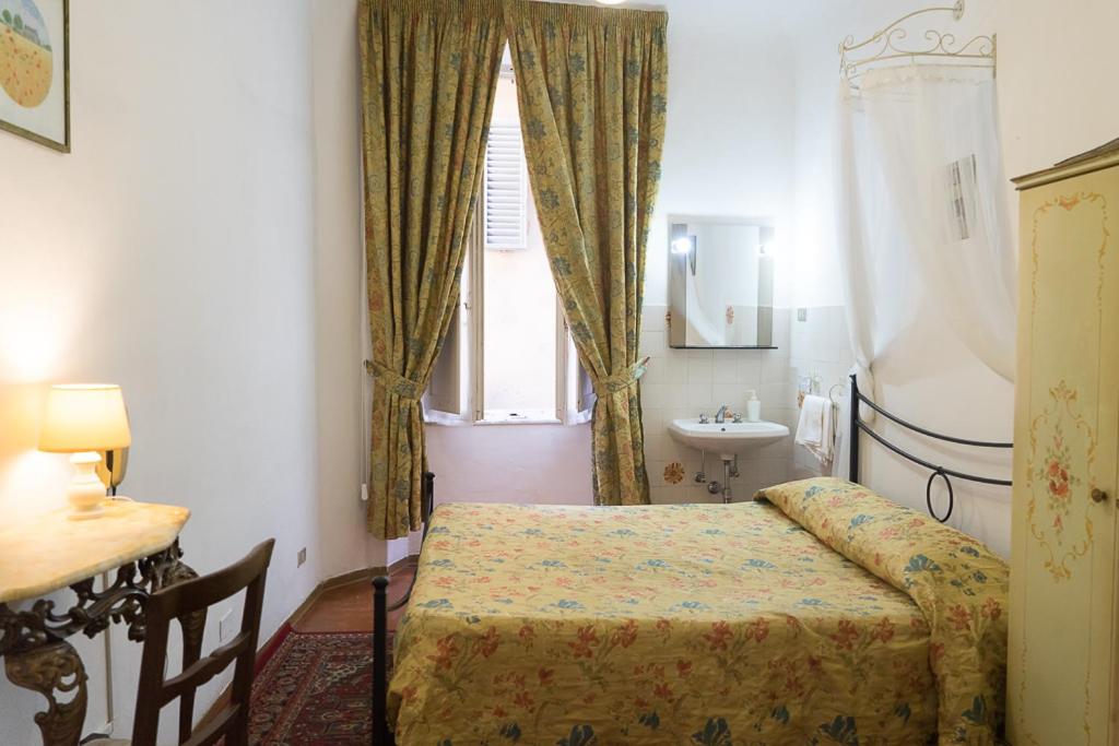 Postel nebo postele na pokoji v ubytování Albergo Tre Donzelle