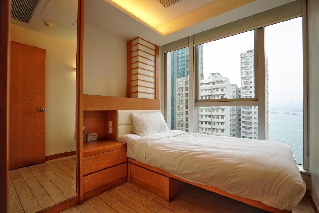Postel nebo postele na pokoji v ubytování Mia Casa Hotel