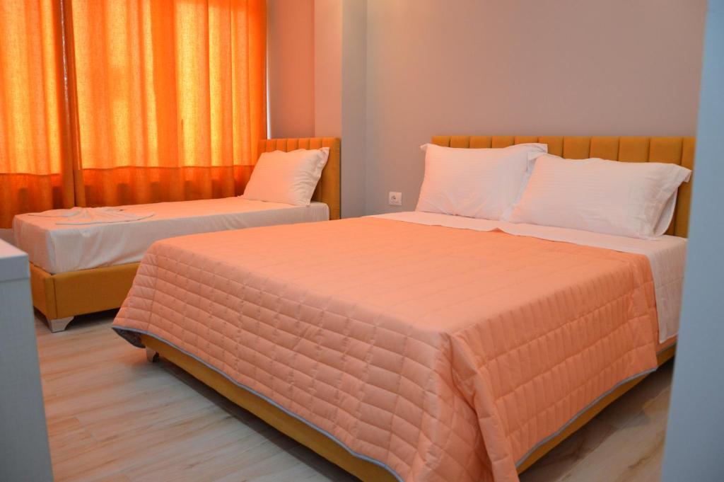 Postel nebo postele na pokoji v ubytování Hotel Beler