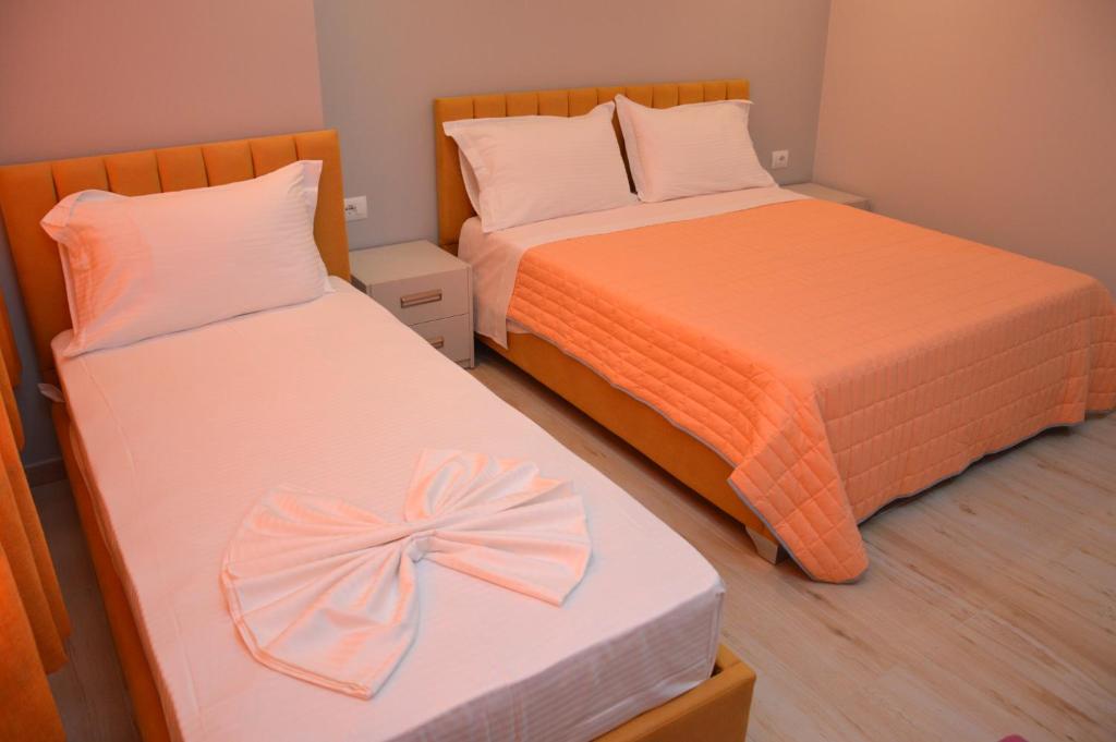 Postel nebo postele na pokoji v ubytování Hotel Beler