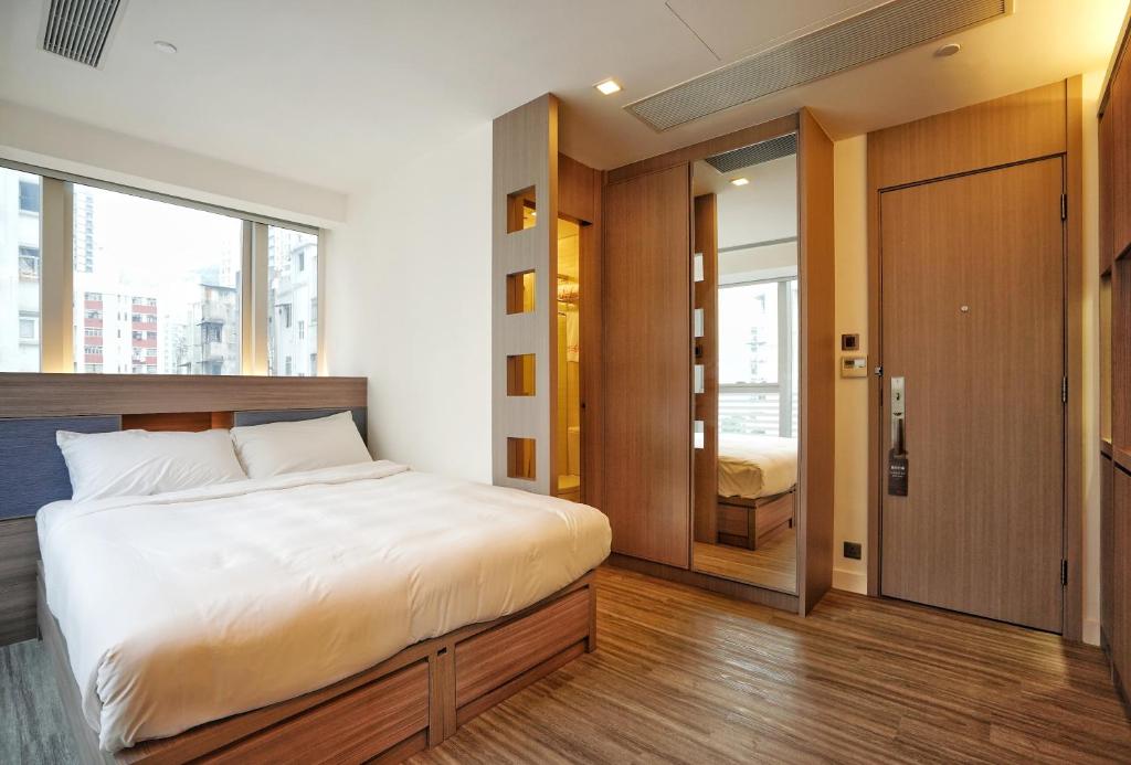 Postel nebo postele na pokoji v ubytování Mia Casa Hotel