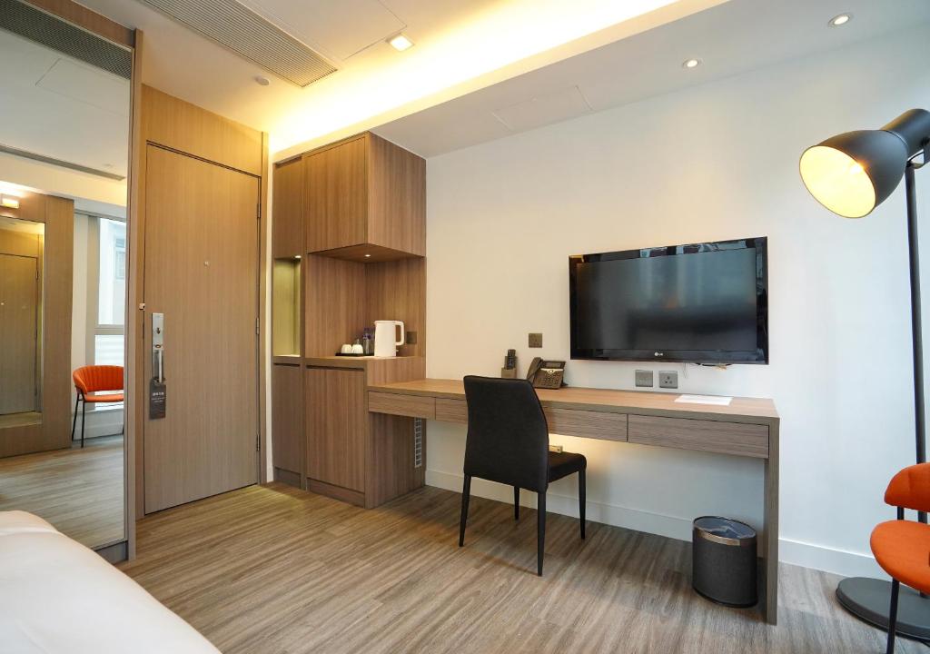 TV a/nebo společenská místnost v ubytování Mia Casa Hotel