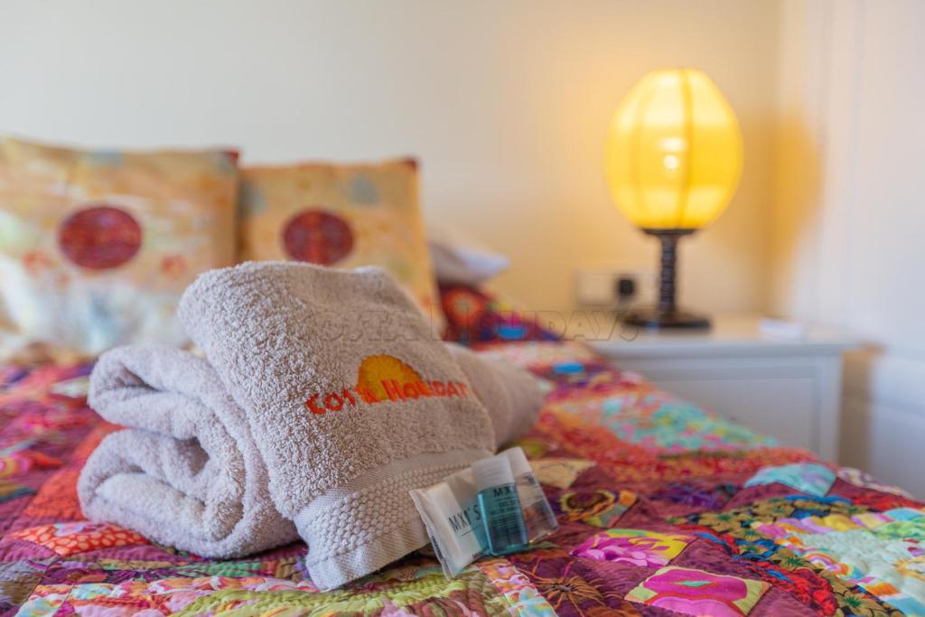 Postel nebo postele na pokoji v ubytování Penthouse Duquesa Suites