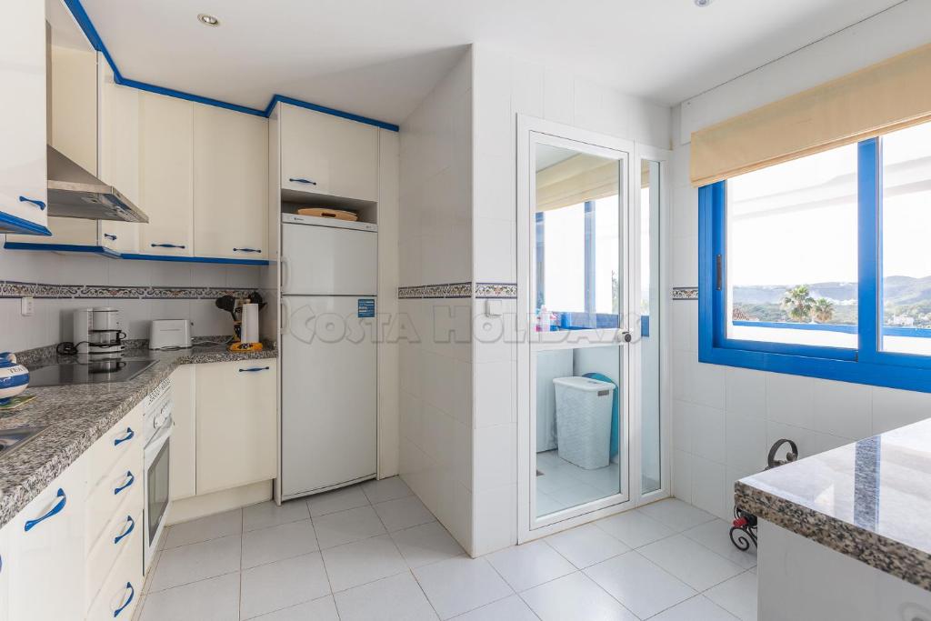 Kuchyň nebo kuchyňský kout v ubytování Penthouse Duquesa Suites