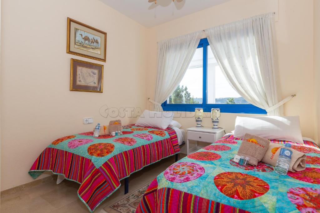 Postel nebo postele na pokoji v ubytování Penthouse Duquesa Suites